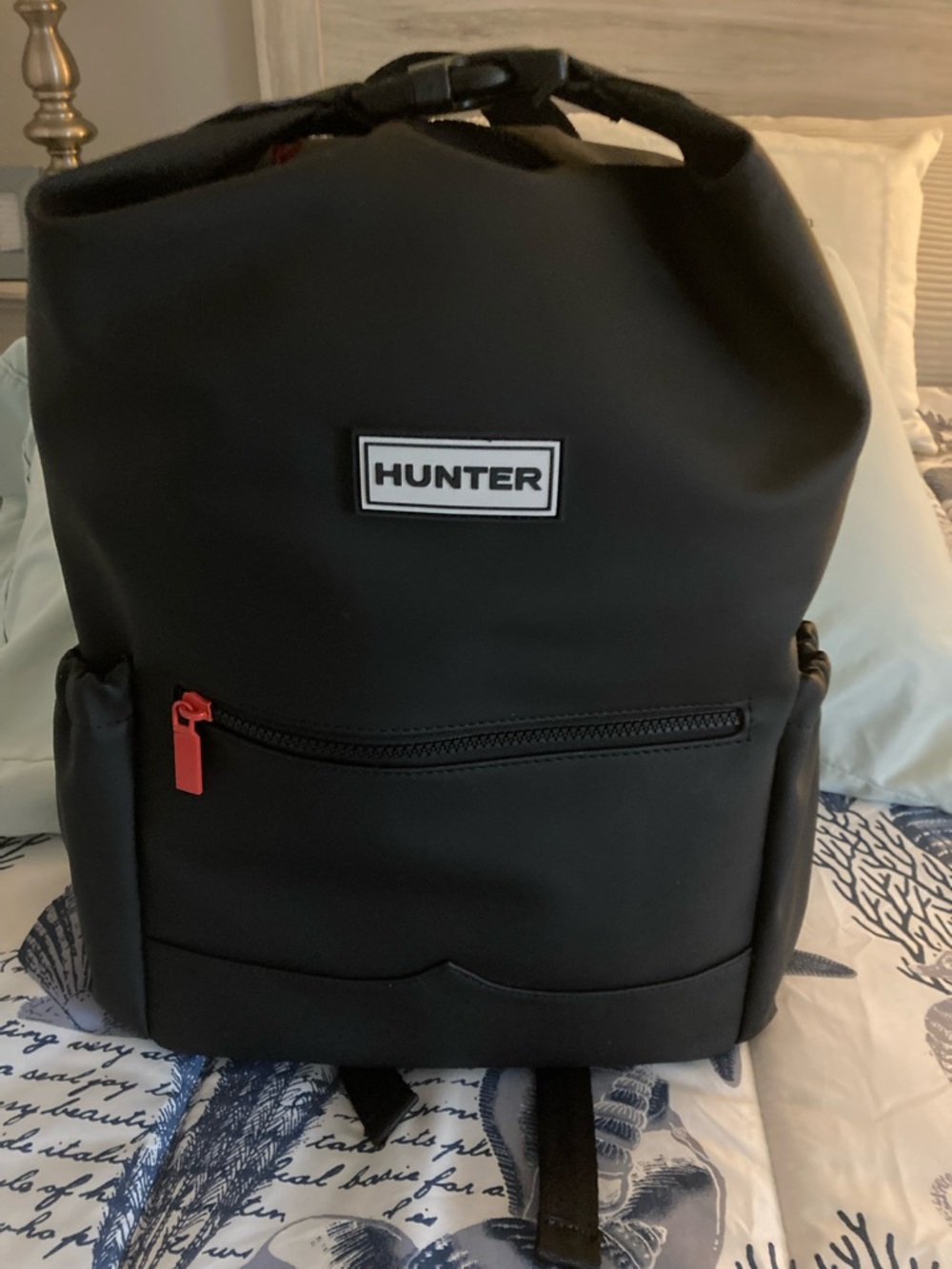 Hunter Black Roll-Top Backpack with Red Zipper Pull